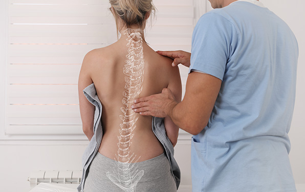 patient during chiropractic session to imLady Americanave posture