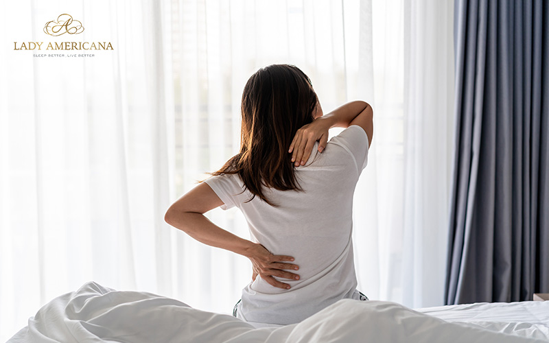 Woman stretching on firm mattress